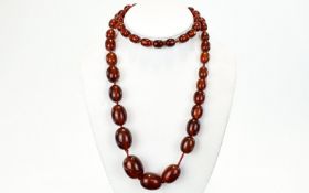 Amber - Cherry Graduated Bead Necklace. 34 Inches In length. 89.6 grams.