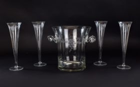 Toscany Handblown Engraved Glass Ice Bucket, together with 4 tall tulip shaped champagne flutes.