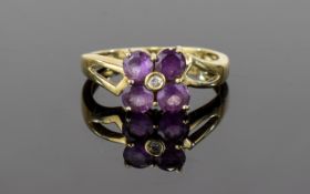 9ct Diamond Amethyst Ring Attractive flowerhead setting comprising four faceted amethyst stones