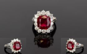 A White Gold Diamond And Synthetic Ruby Ring The diamonds approx 1.