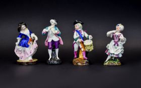 Two Matched Pairs of Fairing Figures, the first pair dressed in white with magenta decoration