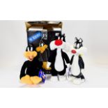 Warner Bros Daffy Figurine and Warner Bros Sylvester & Tweety Figurine.