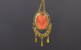 High Carat Antique Coral Pendant Attractive oval pendant with carved Grecian style female cameo