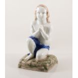 Stoneware figure of a praying boy, 21cm.