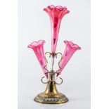 Late Victorian epergne, with four cranberry glass flutes, circular base with beaded outline, 41cm.