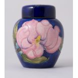 Walter Moorcroft, 'Magnolia' a ginger jar and cover, circa 1980, navy ground, stamped Pottery marks,