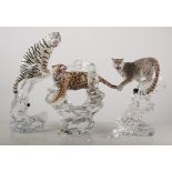 Three figure of large cats, on sculptured glass plinths, snow leopard, tiger etc, (3).