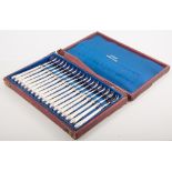 A cased set of eighteen French silver oyster forks, maker's mark for Edouard Corvasier,