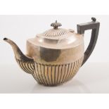 An Edwardian oval silver teapot, Henry Williamson Ltd, Birmingham 1908, semi-fluted body,