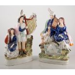 Staffordshire figure clock group, 34cm tall, and musician group, (2).
