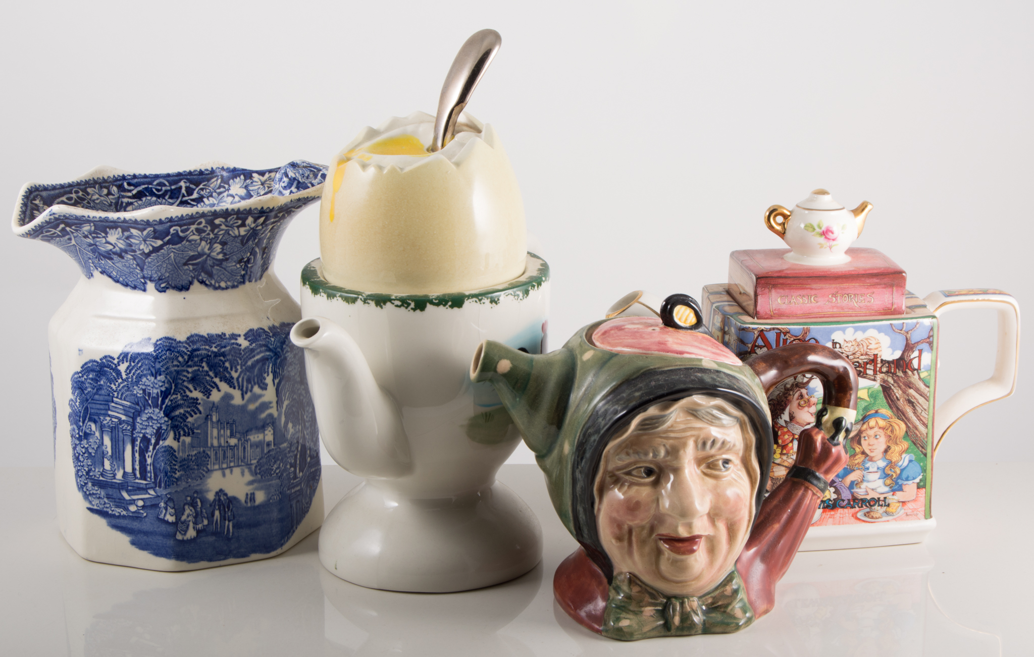 Novelty teapots, including penguin shaped, AGA shaped, boiled egg shaped and others, two boxes.