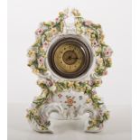 Continental porcelain mantel clock, encrusted and painted decoration with roses,No.1037, 23cms.