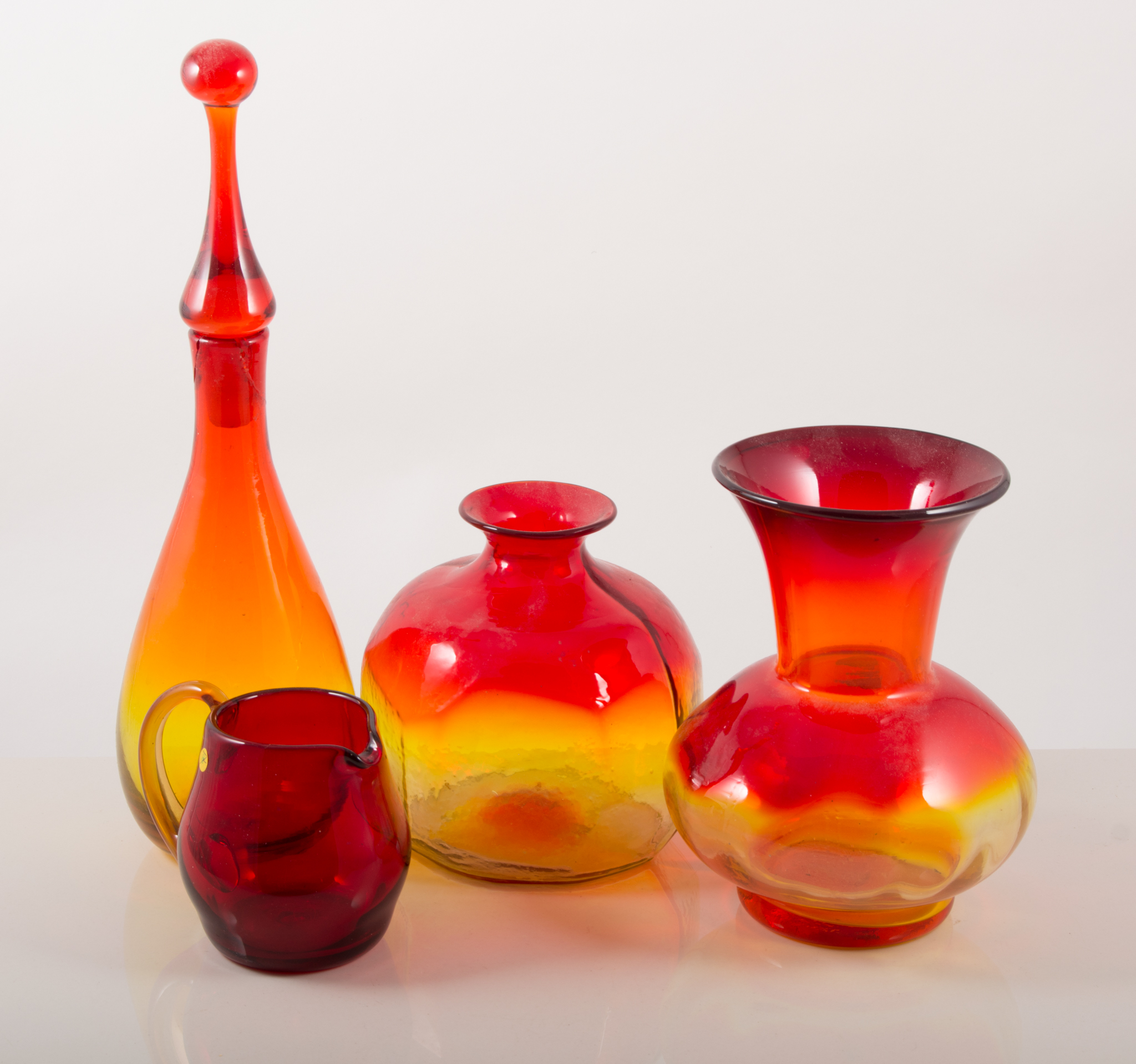 Blenko Art Glass: a large decanter with stopper, a cubist form form, handkerchief vase,