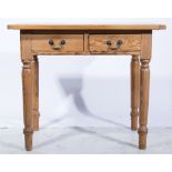 Pine kitchen table, rectangular boarded top with cleated ends, two frieze drawers, turned legs,