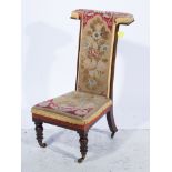 Victorian rosewood prie-dieu, needlepoint upholstery, turned legs, width 47cm.