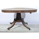 George IV rosewood circular dining table, with beaded frieze, raised on tapering canted column,