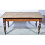 Victorian pine kitchen table, rounded rectangular top raised on turned legs, W150cm x D89cm x H72cm.