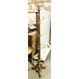 Mahogany coat stand, revolving brass fittings.