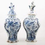 Pair of 19th century Continental tin glazed moulded balaster shoulder vases and covers,