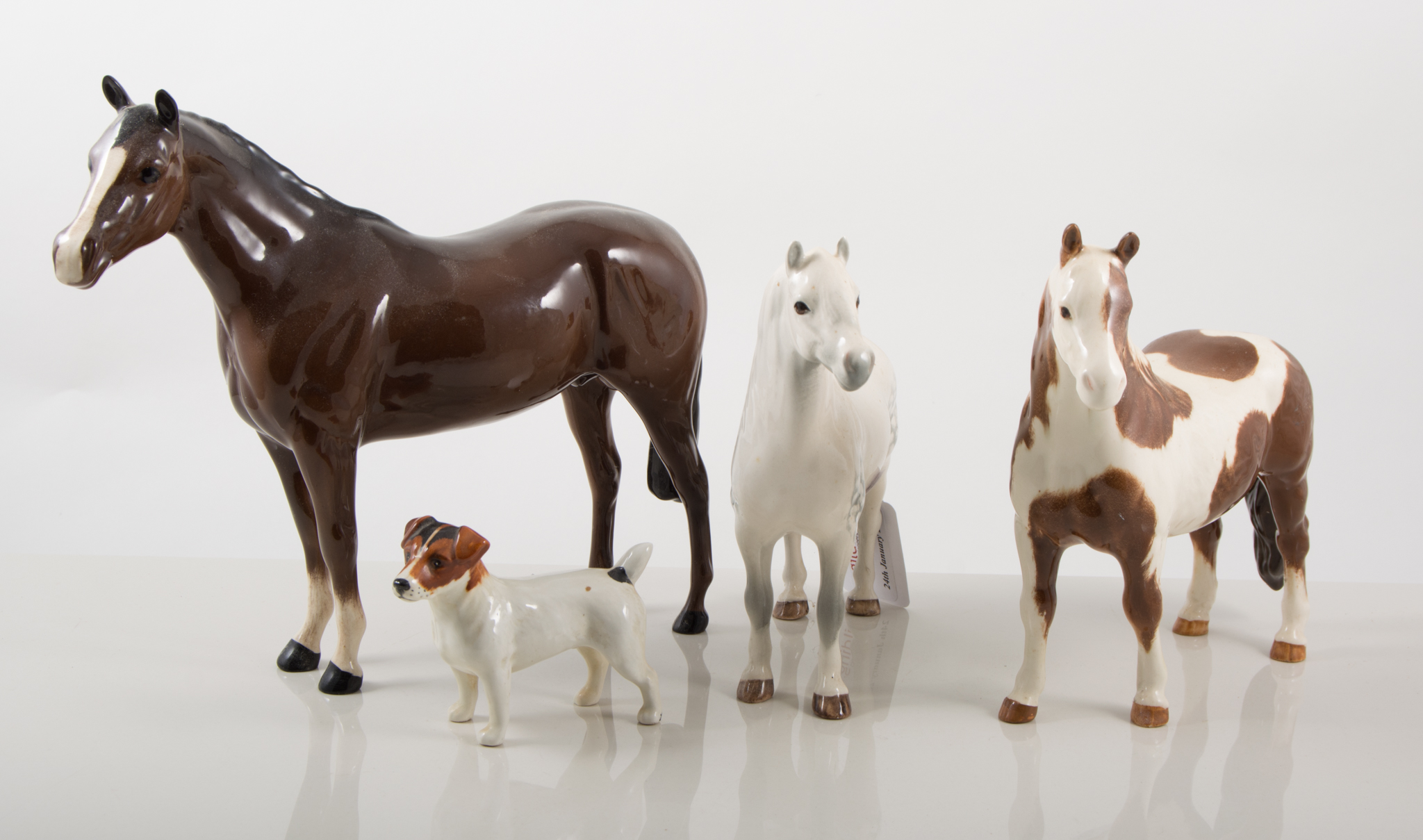 Beswick figures, Welsh horse, 16cm; and a Pinto horse, 17cm; Beswick dog Terrier,