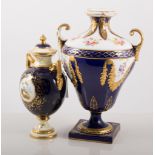 Small Coalport urn-shaped vase, twin handles, painted with an exotic bird, with cover,