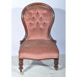 A Victorian mahogany framed nursing chair.