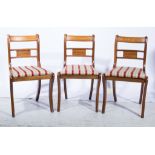 Six reproduction dining chairs, with brass inlay backs, drop-in pads.