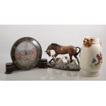 Heredities charm of creamware model, horse and hounds, mahogany effect plinth base,