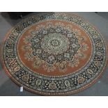 Machine made Tabriz pattern circular carpet.