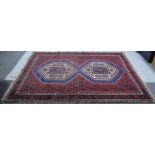Hamadam rug, two tiles, red ground, multiple borders worn, 224cm x 161cm.