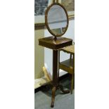 Mahogany shaving mirror on stand, with adjustable oval plate,