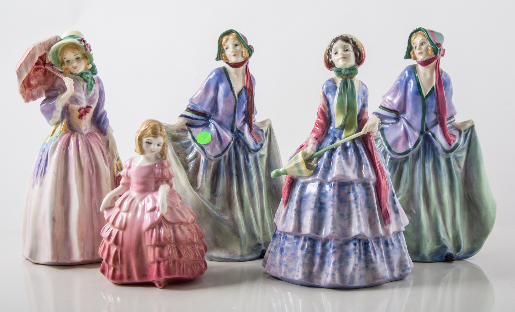 Five early Royal Doulton figurines,