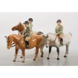 Beswick figures, Girl on a pony; Boy on a pony; and another Boy on a pony, 14cm.