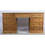 Pine partners twin pedestal desk, fitted with nine drawers, W166cm x D82cm x H82cm.