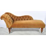 Late Victorian mahogany framed chaise longue, buttoned upholstery, turned supports.