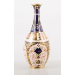 Royal Crown Derby, Imari pattern bottle vase, 20cm; three other vases; octagonal bowl and a plate,