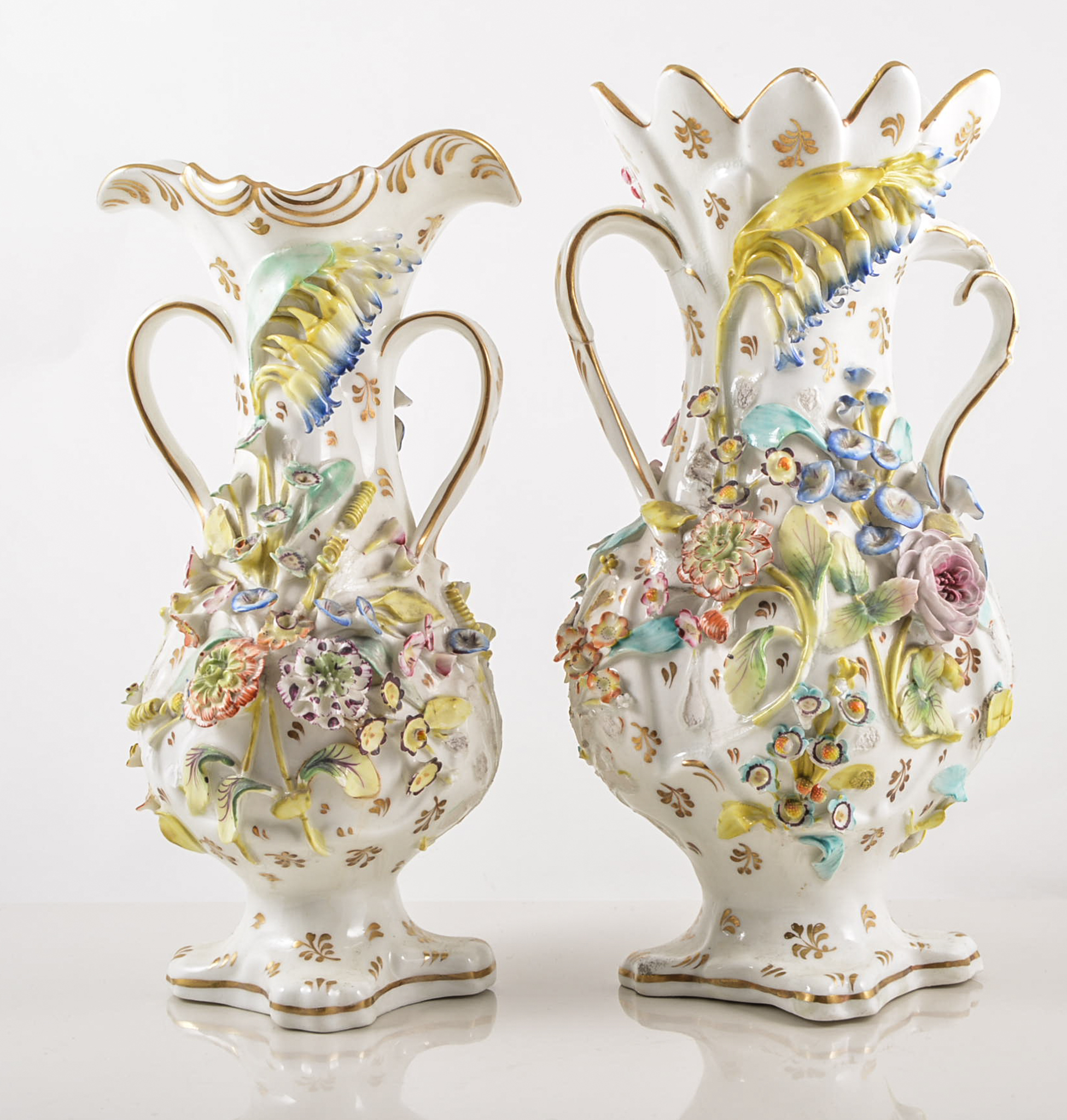 Coalport Coalbrookdale style twin handled vases, applied relief of mixed summer flowers,