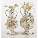 Coalport Coalbrookdale style twin handled vases, applied relief of mixed summer flowers,