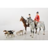 Beswick figures, Fox and Hounds, Huntswoman, 21cm, and another pottery Huntsman,