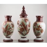 Garniture of three opaque glass vases, late 19th century, ovoid form, one with cover,