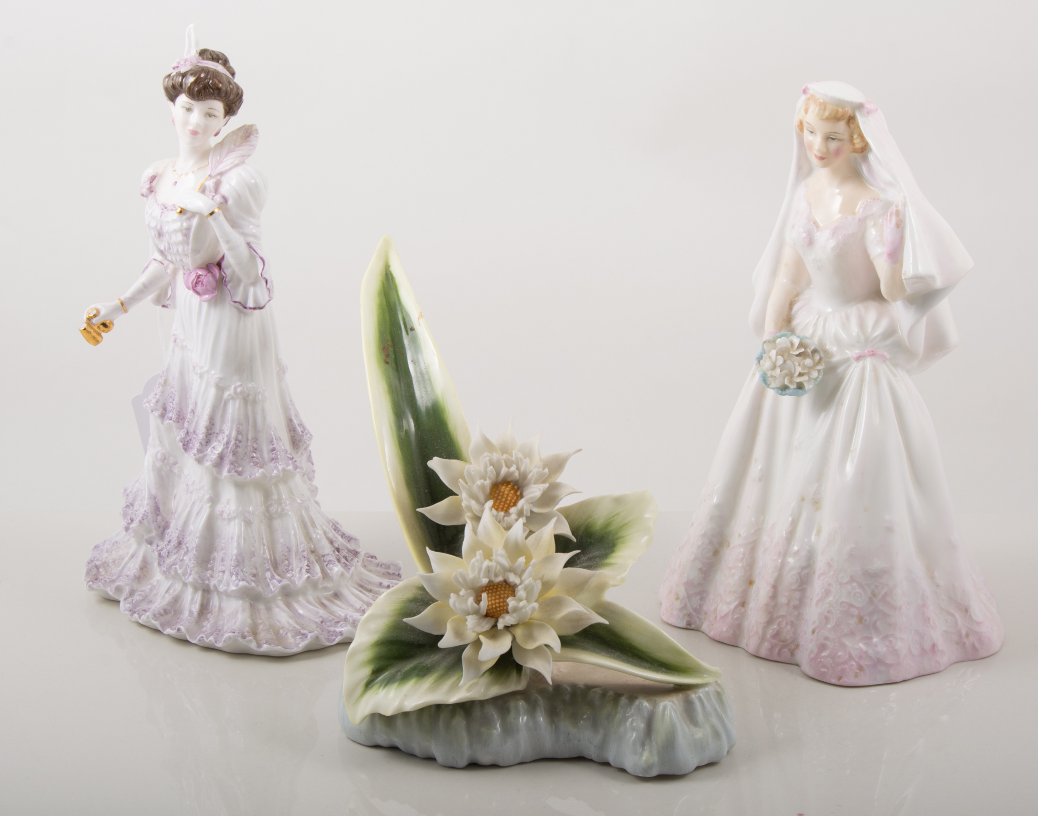 Royal Doulton figure, 'The Bride' HN2166; a Coalport figure 'Eugenie', and a Royal Doulton model,