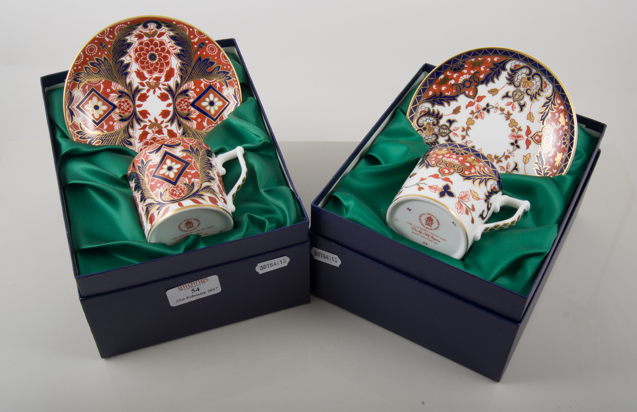 Royal Crown Derby pair of boxed Curator's Collection cups and saucers,