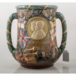 A Royal Doulton two handled loving cup commemorating the Silver Jubilee of King George V and Queen