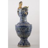 Large German salt glazed stoneware ewer, the handle formed as a female, with griffin form neck,