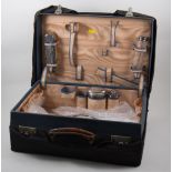 Leather bound travelling case, watered silk interior with some silver mounted accessories,