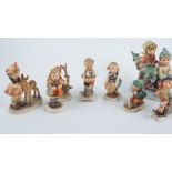 Fifteen Goebel Hummel figurines to include Apple Tree Boy and Apple Tree Girl, Soldier Boy,