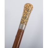 18th Century Malacca walking cane with ivory and pique handle.