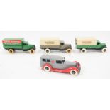 Four pre-war Dinky Toys, including four model 25B covered wagons and one 30F Bentley Ambulance,