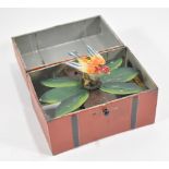 Automated toy bird in a box, of enamelled tin plate construction, with winder on base,