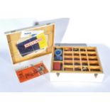 Large wooden box containing Meccano parts, including strip plates, plates, brass gears,